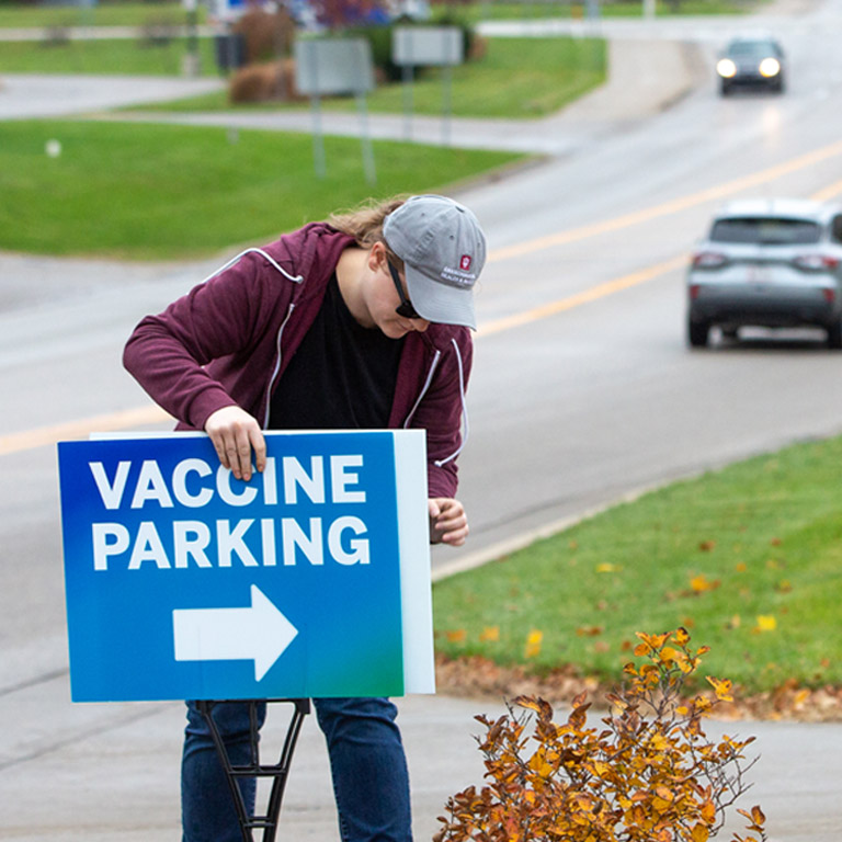 An IU employee sets up for a vaccine clinic